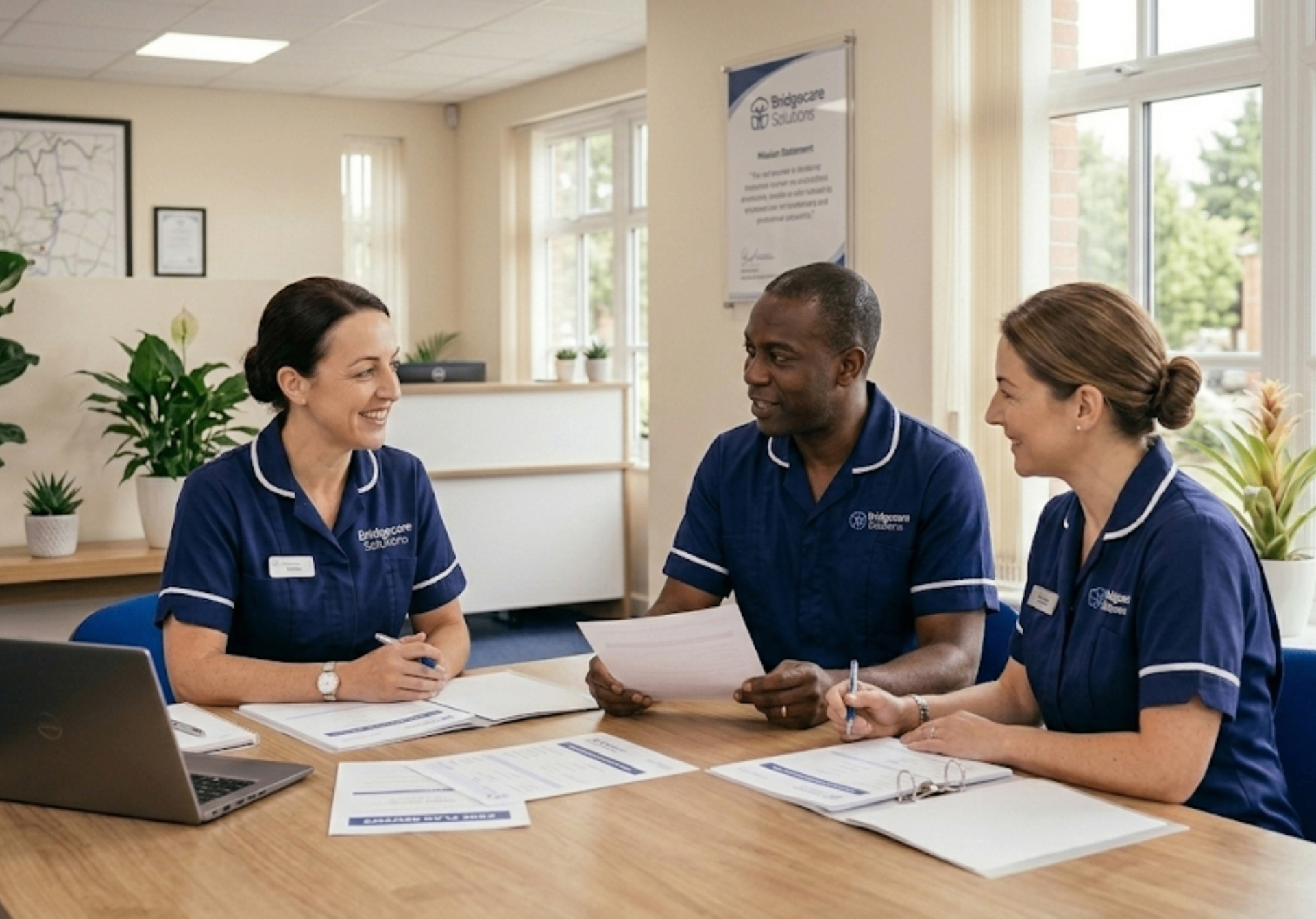 Bridgecare Solutions registered manager and care coordinators in team meeting at Stevenage office
